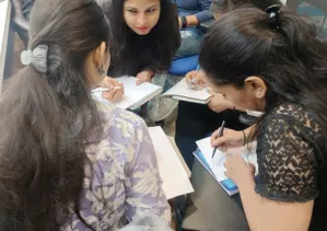 Group photo of workshop participants in a modern meeting room